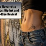 Inde Navarrette poses in low-rise jeans, displaying her hip tattoos.